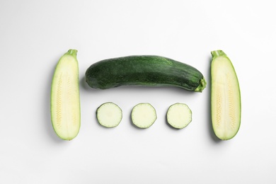 Photo of Fresh ripe green zucchinis on white background, top view