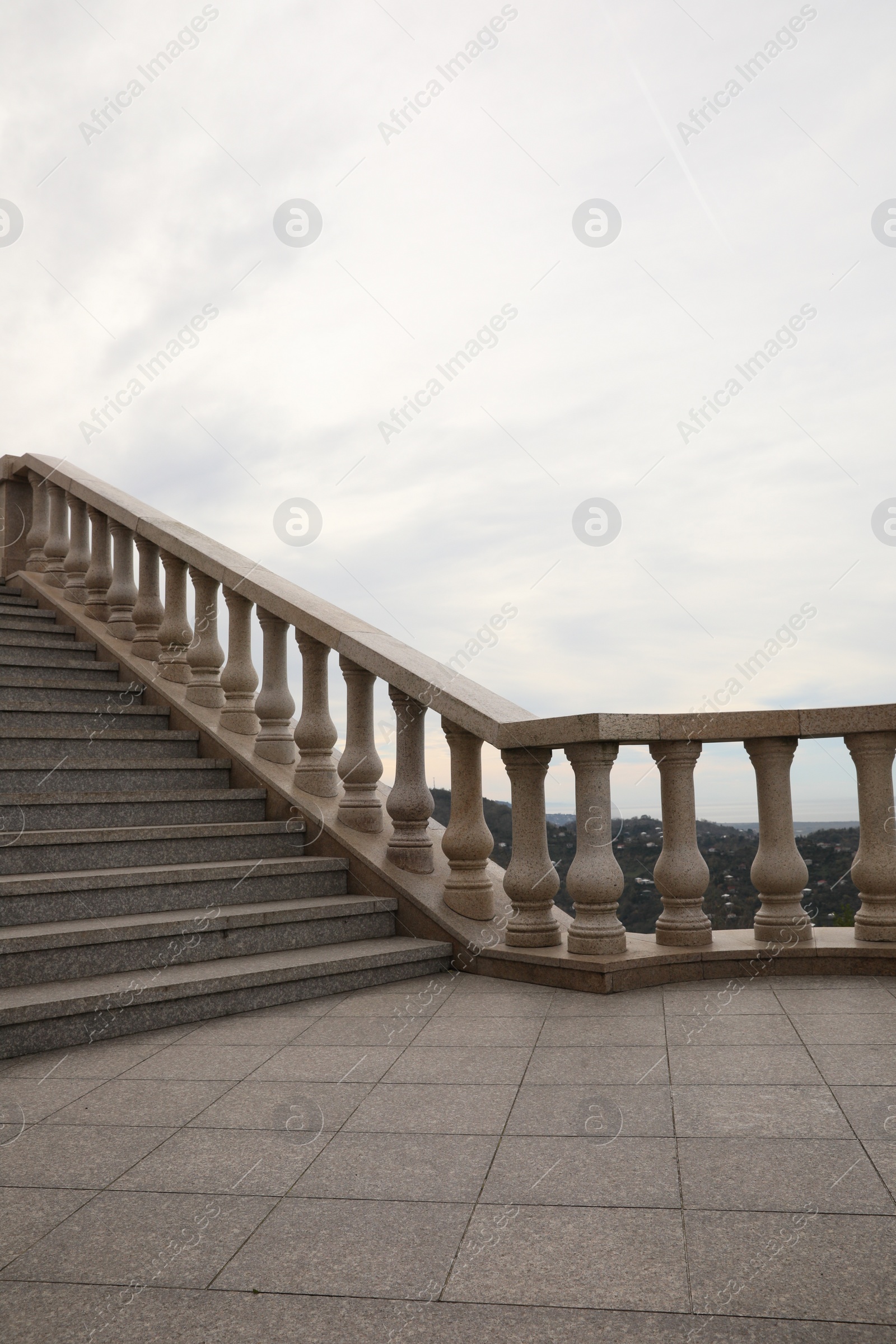 Photo of Beautiful stairs on city street under cloudy sky