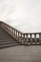 Beautiful stairs on city street under cloudy sky