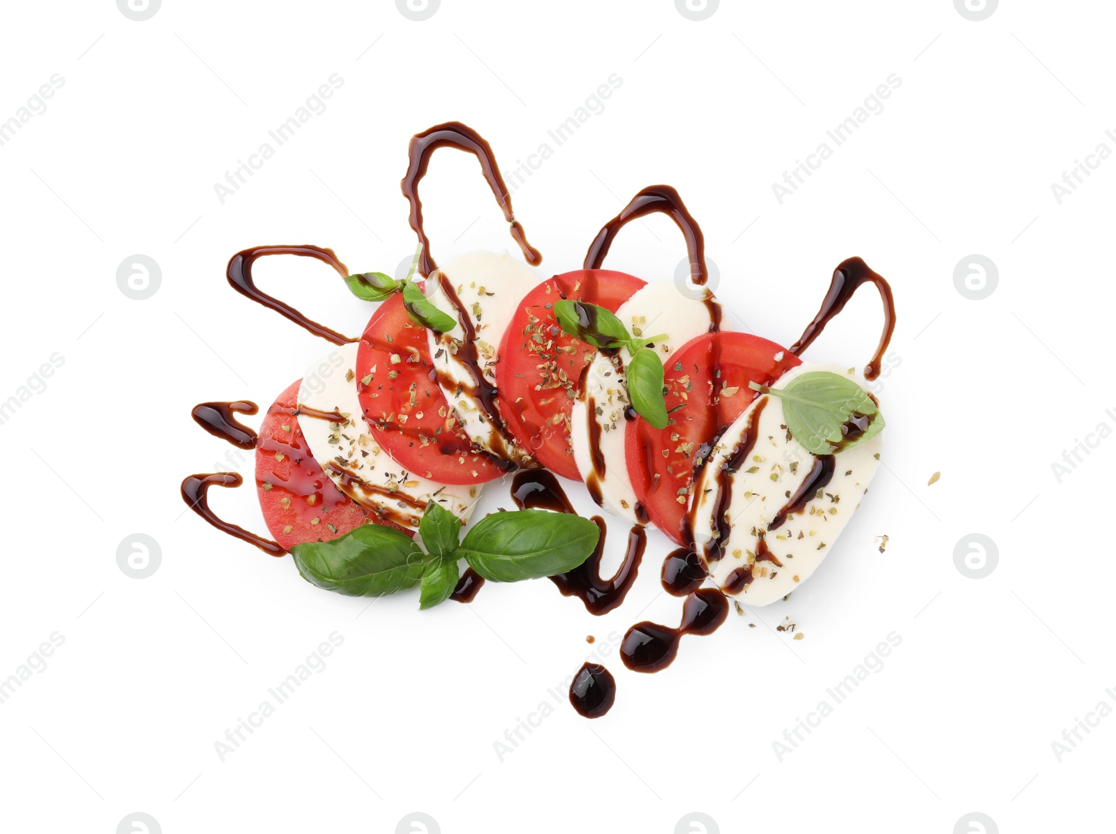 Photo of Tasty salad Caprese with mozzarella, tomatoes, basil and sauce on white background, top view