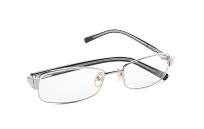 Photo of Glasses with corrective lenses on white background. Vision problem