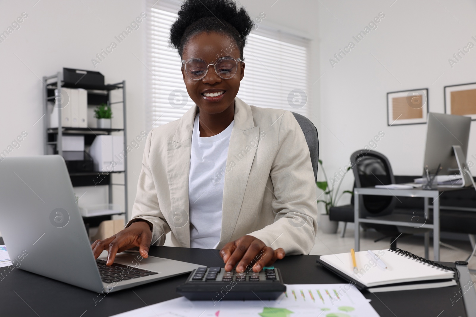 Photo of Professional accountant working at desk in office