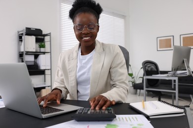 Professional accountant working at desk in office