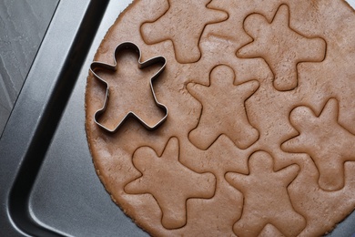 Photo of Making homemade gingerbread man cookies in baking dish , top view