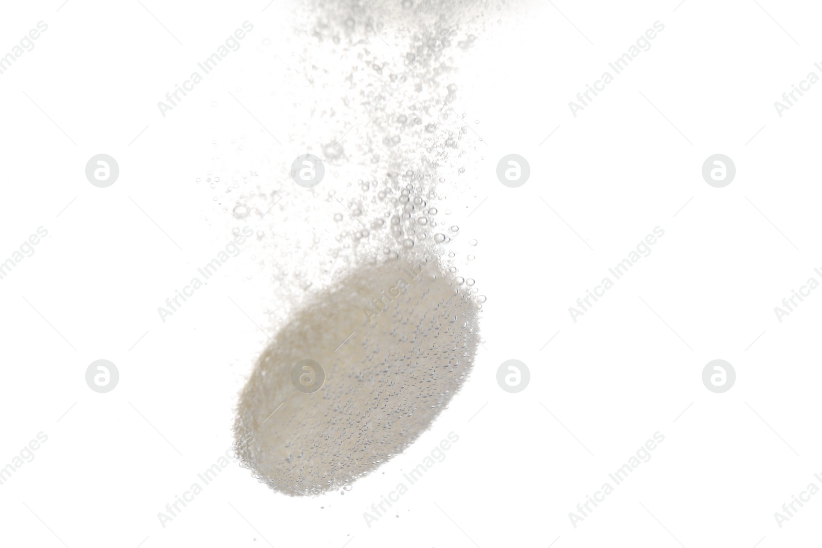 Photo of Effervescent pill dissolving in water on white background, closeup