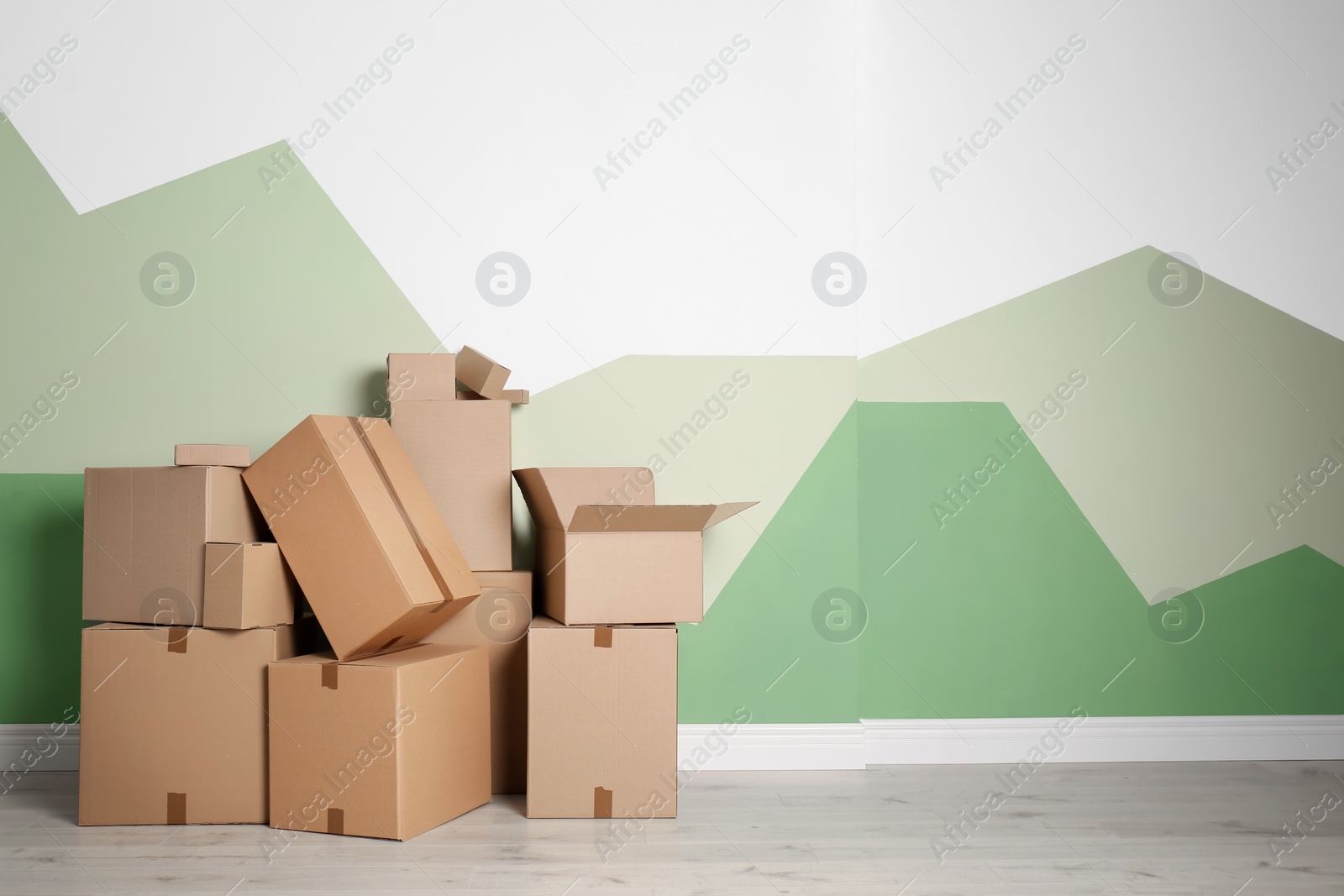 Photo of Cardboard boxes on floor indoors