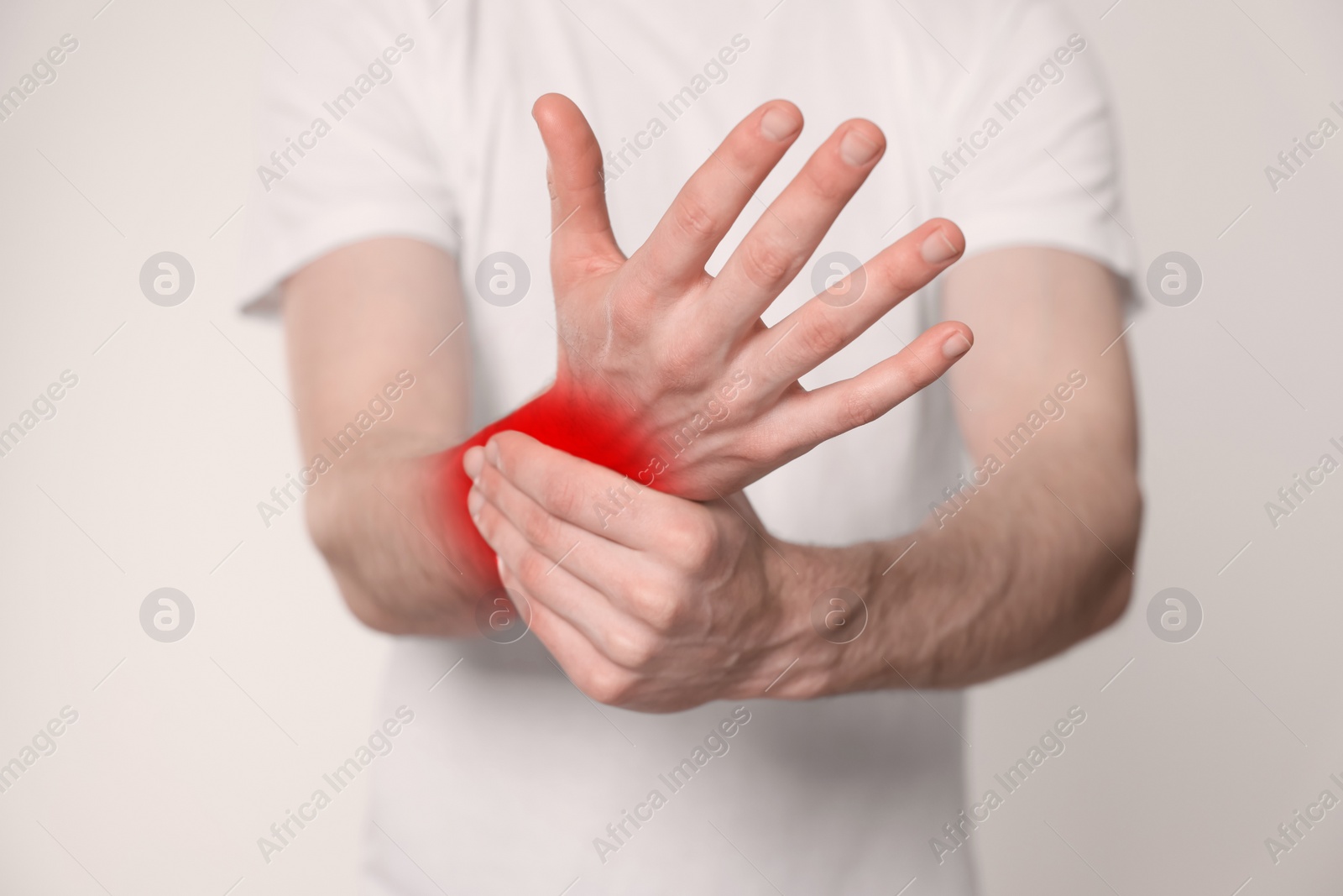 Image of Man suffering from rheumatism on light background, closeup