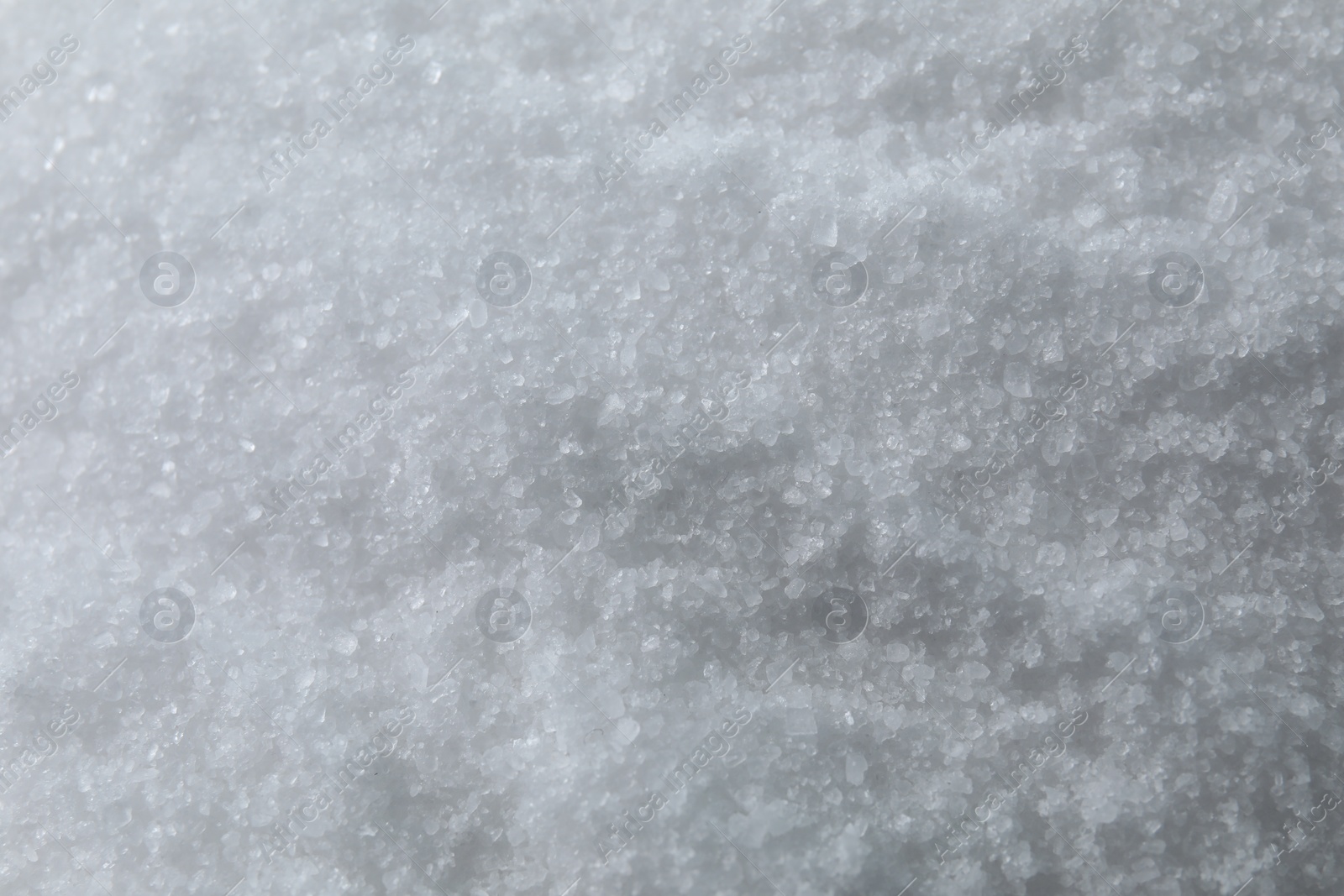 Photo of Organic white sea salt as background, above view