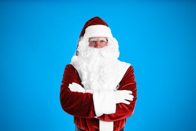 Photo of Portrait of Santa Claus on light blue background