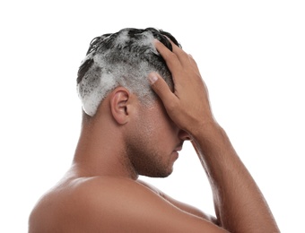 Photo of Man washing hair on white background. Personal hygiene