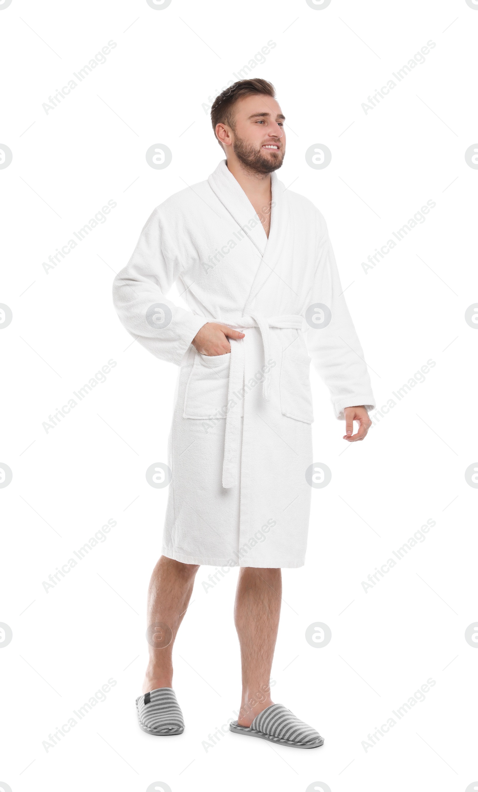 Photo of Handsome man wearing bathrobe on white background