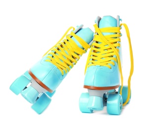 Photo of Pair of bright stylish roller skates on white background