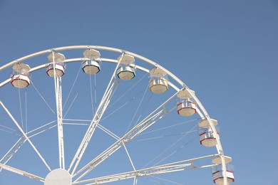 Beautiful white ferris wheel against blue sky