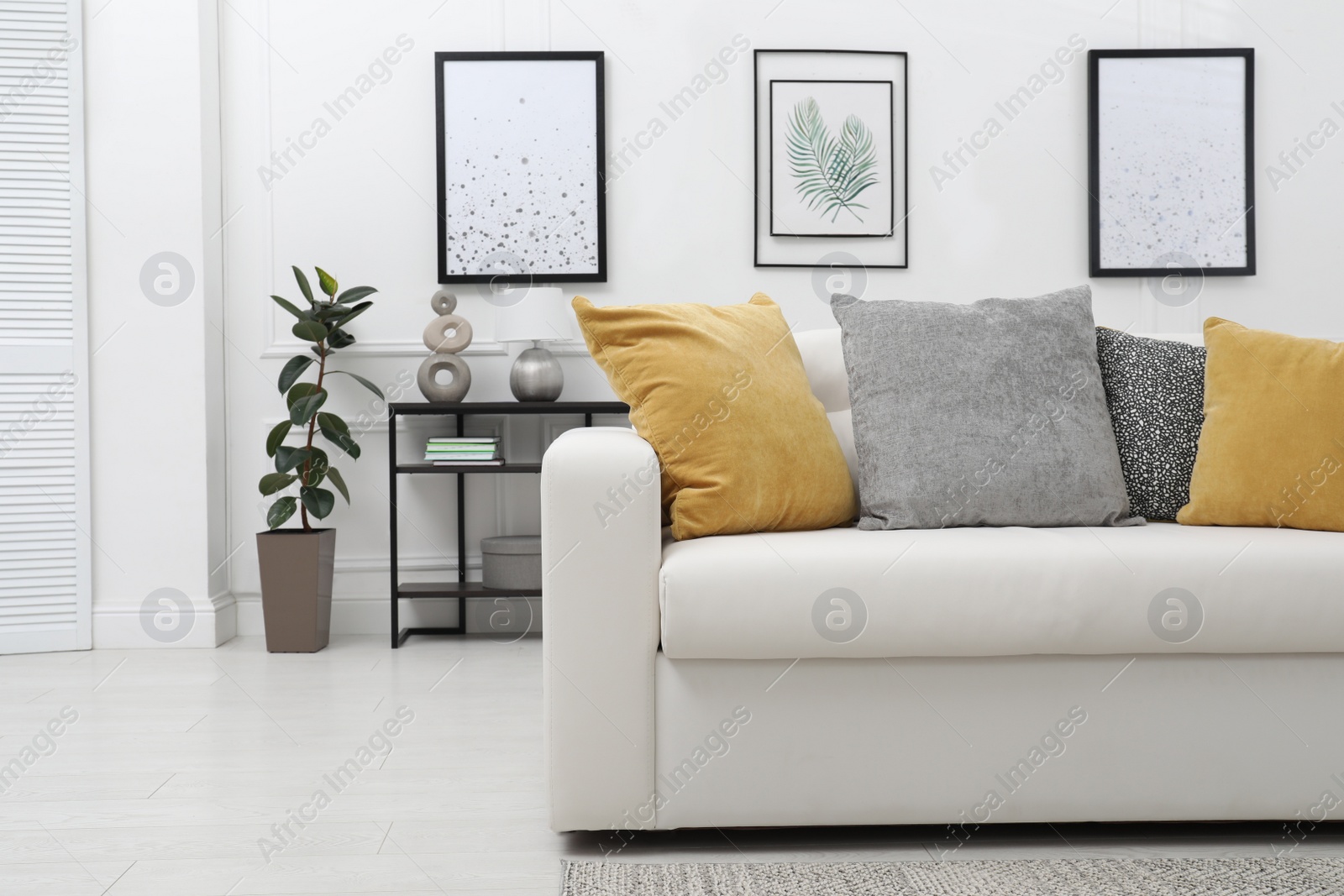 Photo of Stylish living room interior with comfortable sofa