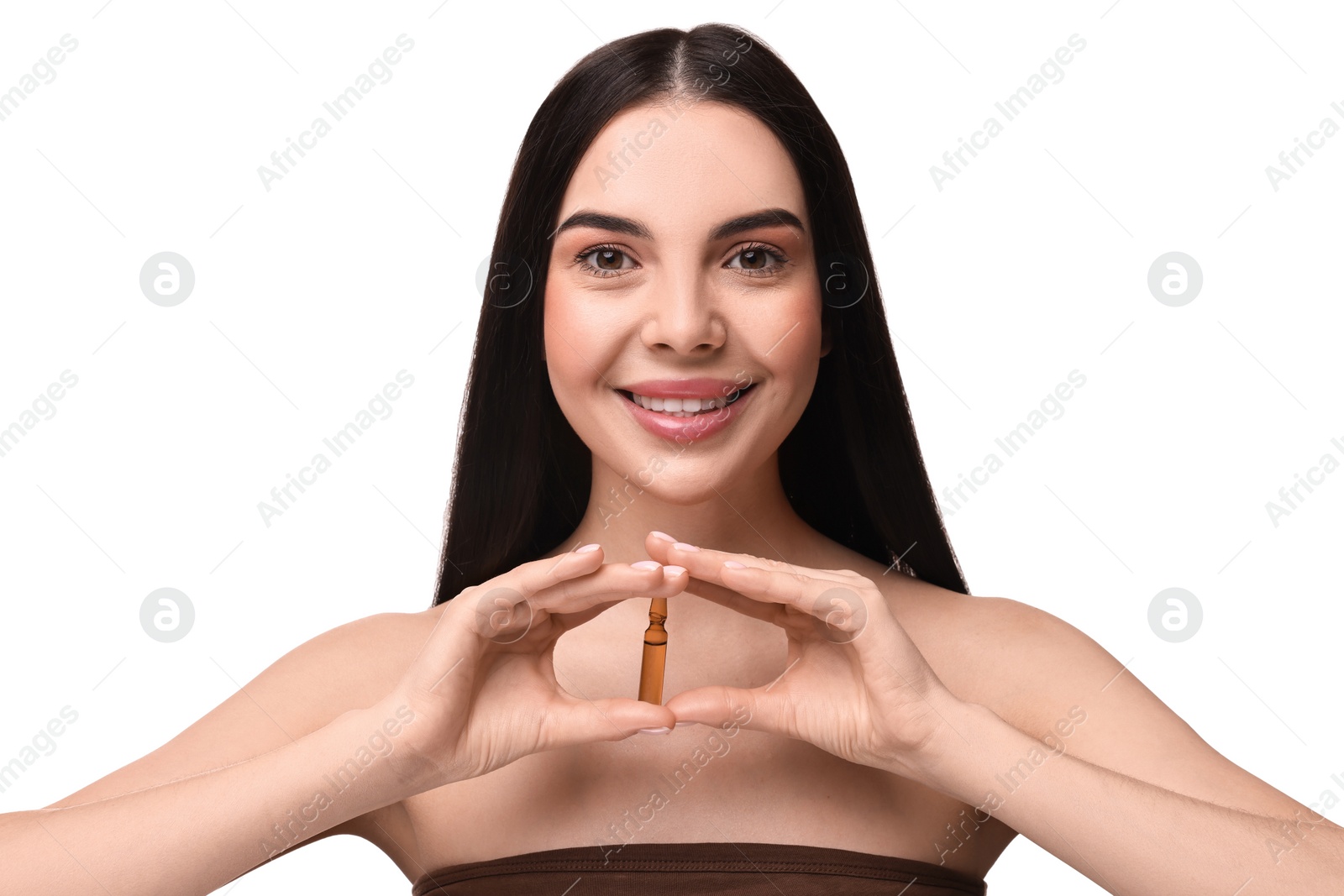 Photo of Beautiful young woman holding skincare ampoule on white background