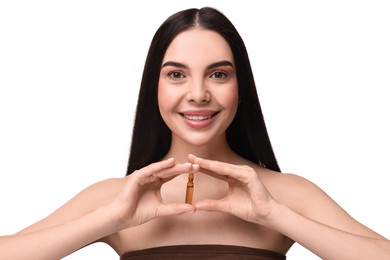 Photo of Beautiful young woman holding skincare ampoule on white background