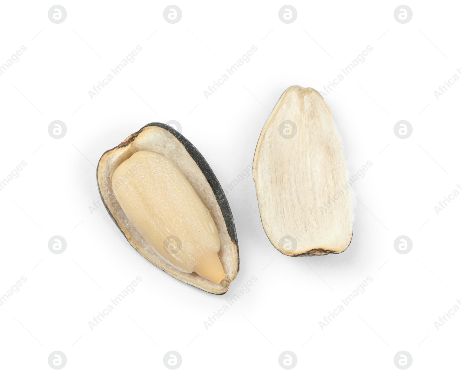 Photo of Raw peeled sunflower seed and shell isolated on white, top view