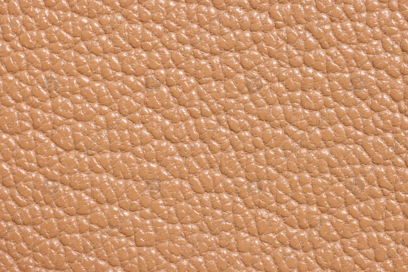 Photo of Light brown natural leather as background, top view