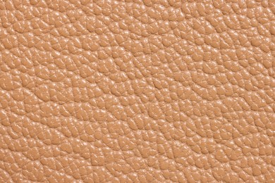 Light brown natural leather as background, top view
