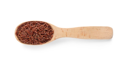 Photo of Wooden spoon with brown rice on white background, top view