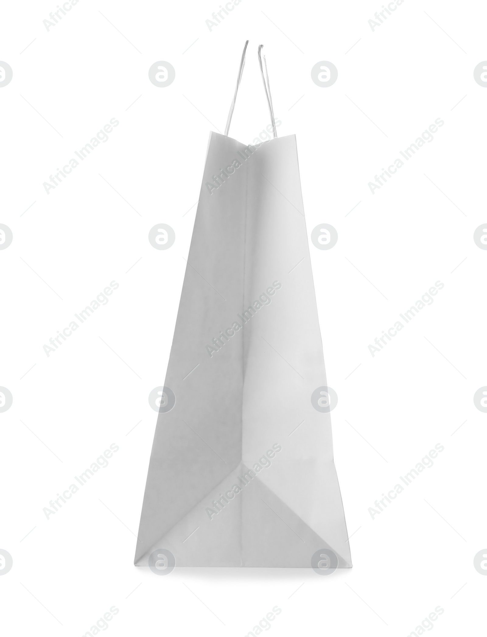 Photo of Empty paper shopping bag on white background