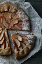 Delicious apple galette on wooden table, top view