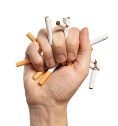Photo of Stop smoking. Man holding broken cigarettes on white background, closeup