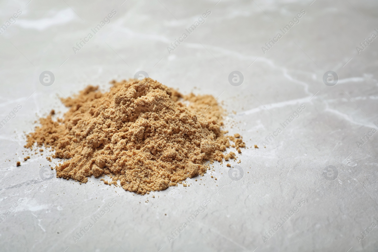 Photo of Pile of pumpkin flour on table