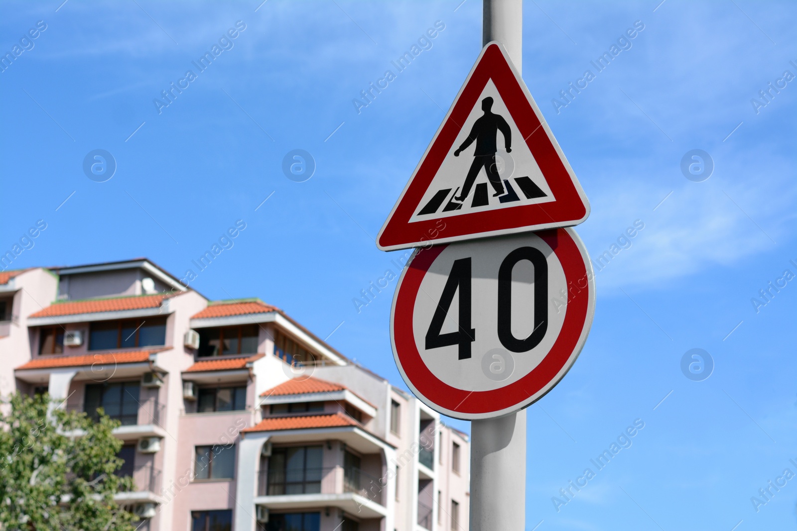 Photo of Post with different road signs outdoors on sunny day