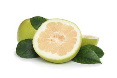 Photo of Whole and cut sweetie fruits with green leaves on white background