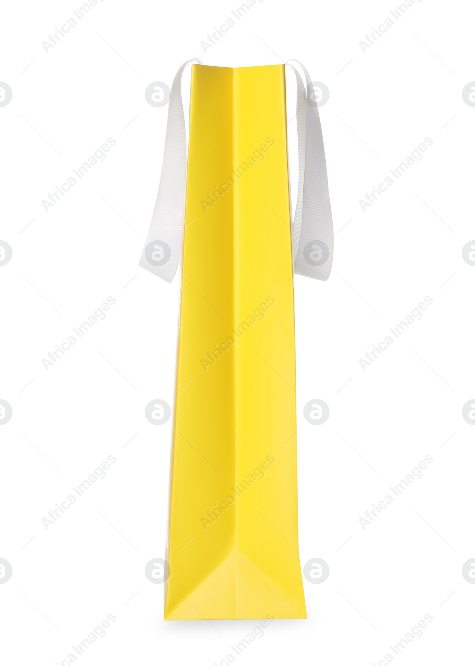 Photo of One yellow shopping bag isolated on white