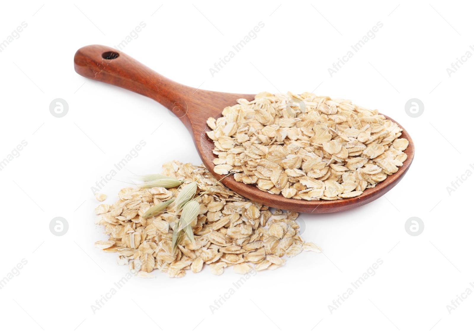 Photo of Wooden spoon with oatmeal and florets isolated on white