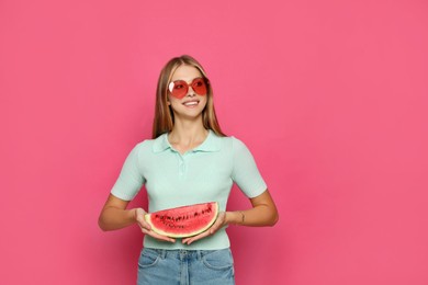 Photo of Beautiful girl with slice of watermelon on crimson background