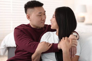 Portrait of lovely young couple at home