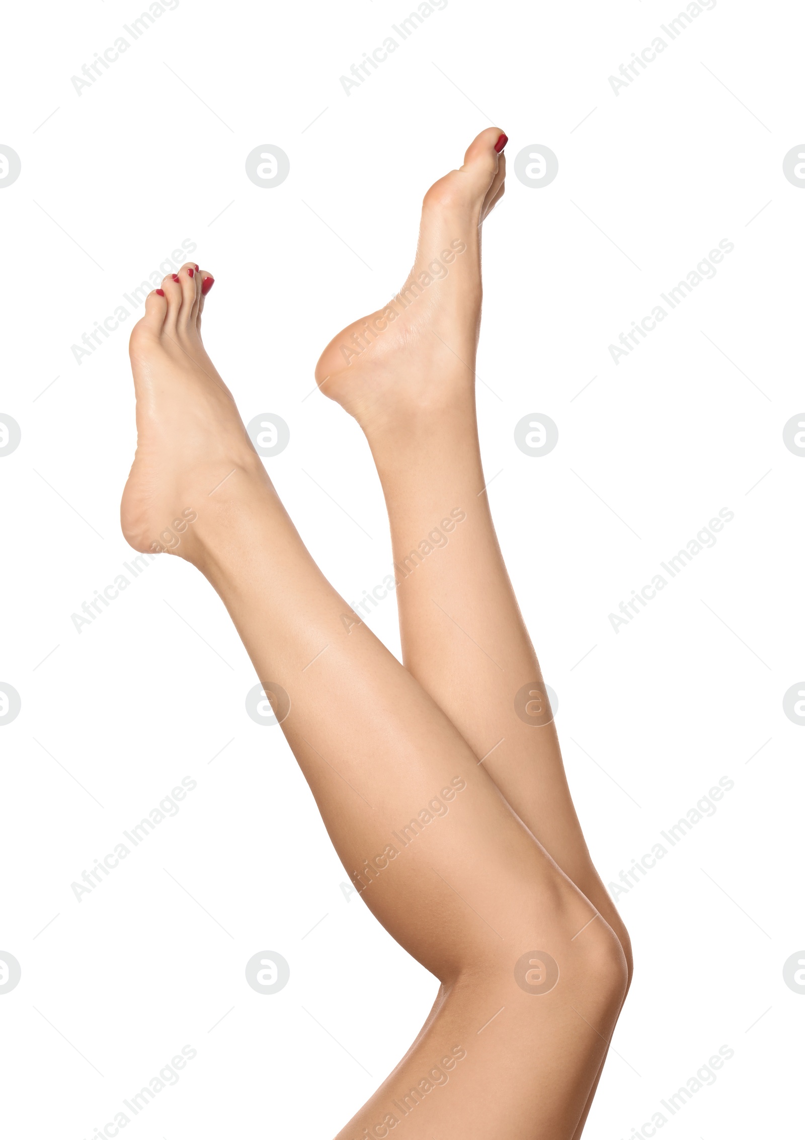 Photo of Woman with stylish red toenails after pedicure procedure isolated on white, closeup