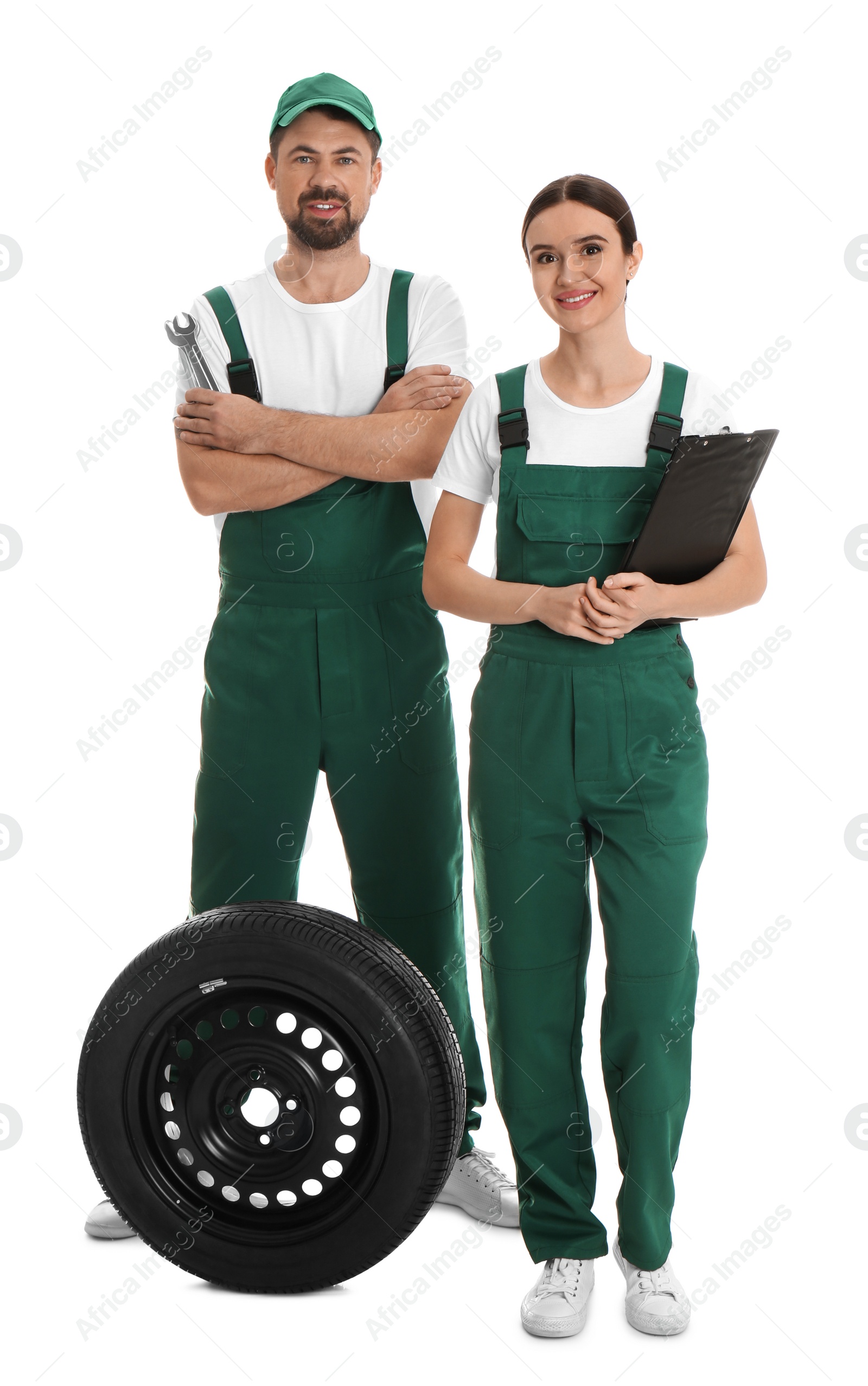 Photo of Full length portrait of professional auto mechanics on white background