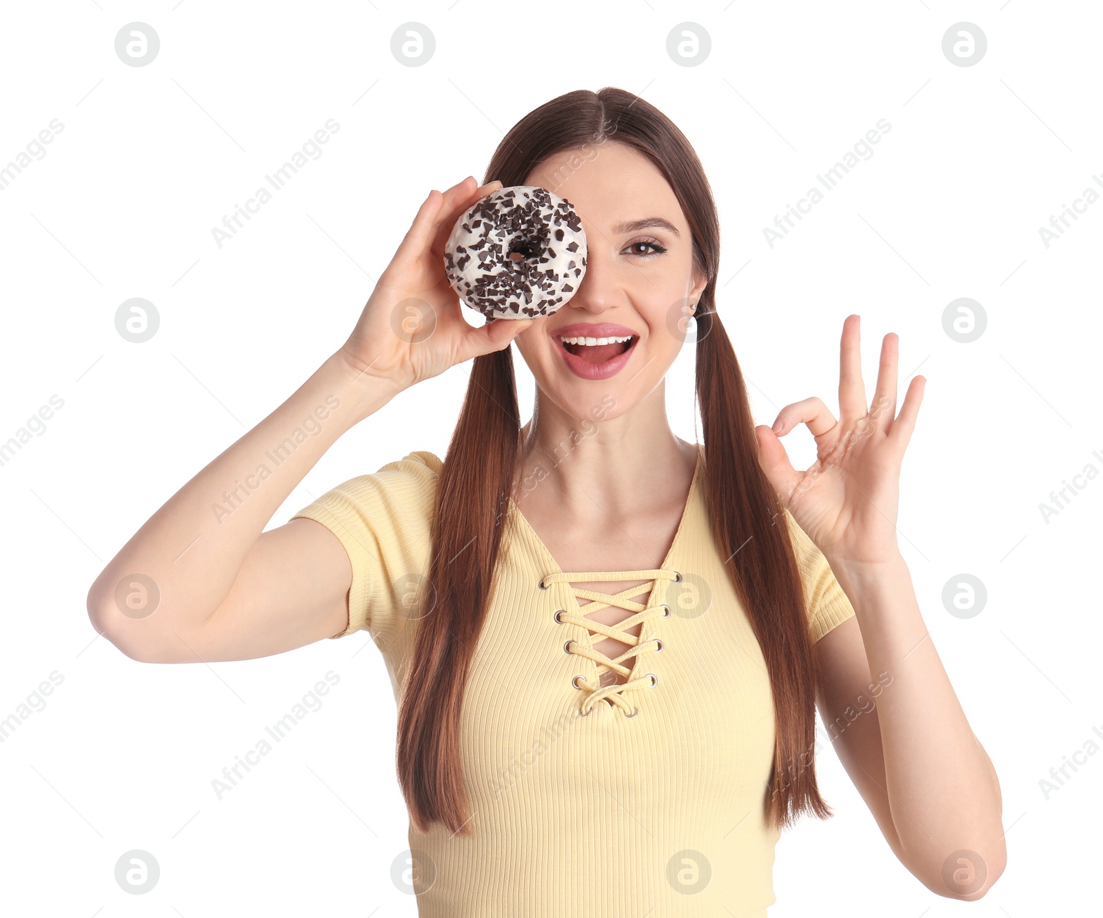 Photo of Beautiful young woman with donut on white background