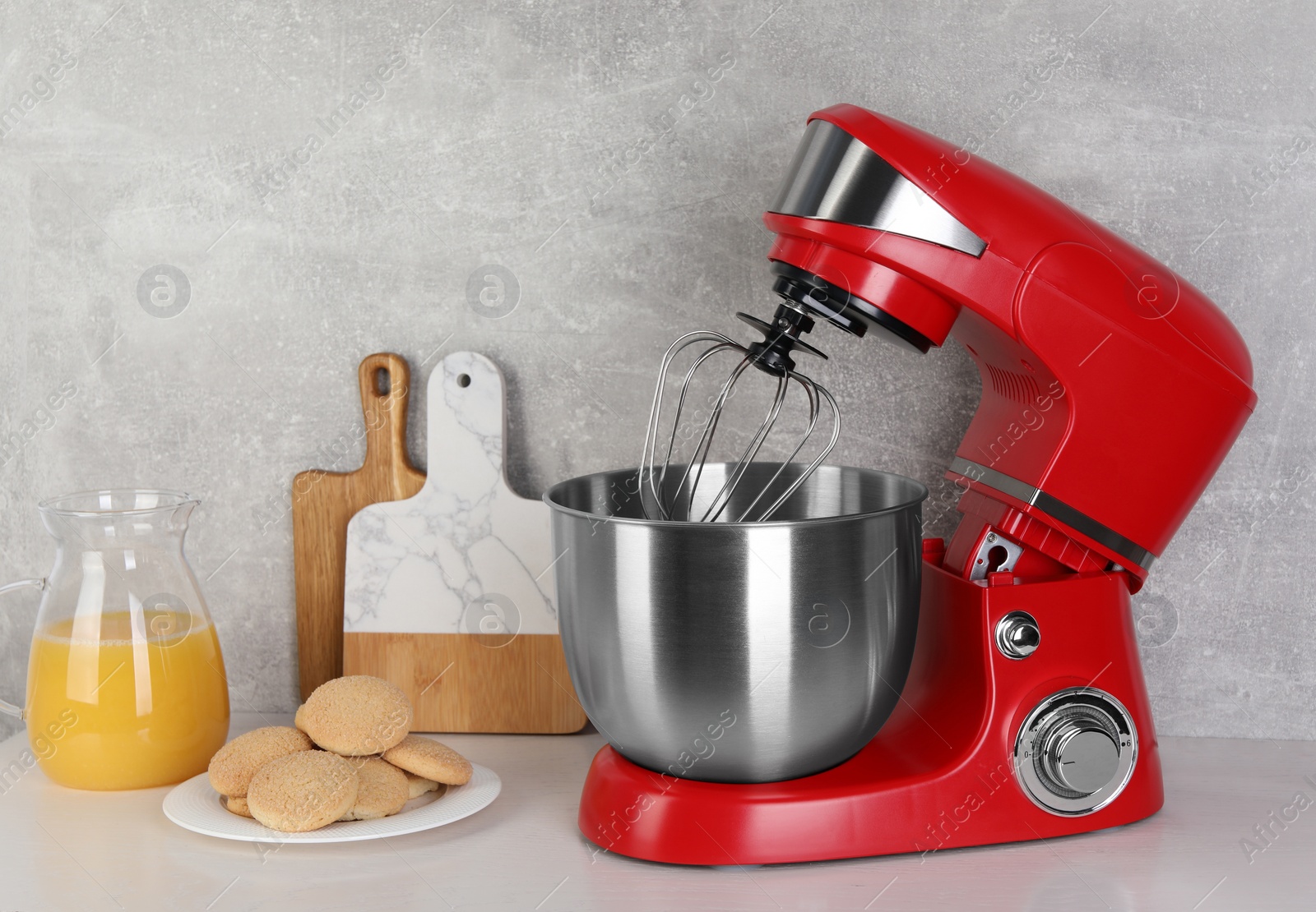 Photo of Composition with modern red stand mixer and different products on white table