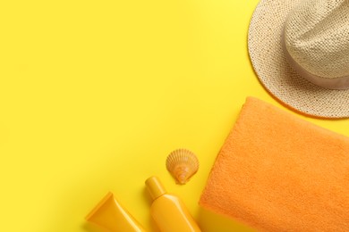 Photo of Flat lay composition with different beach objects on yellow background, space for text