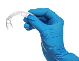 Photo of Dentist holding teeth cover on white background