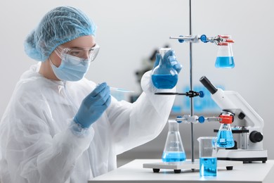 Photo of Young scientist working with samples in laboratory