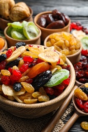 Composition with different dried fruits on wooden background. Healthy lifestyle