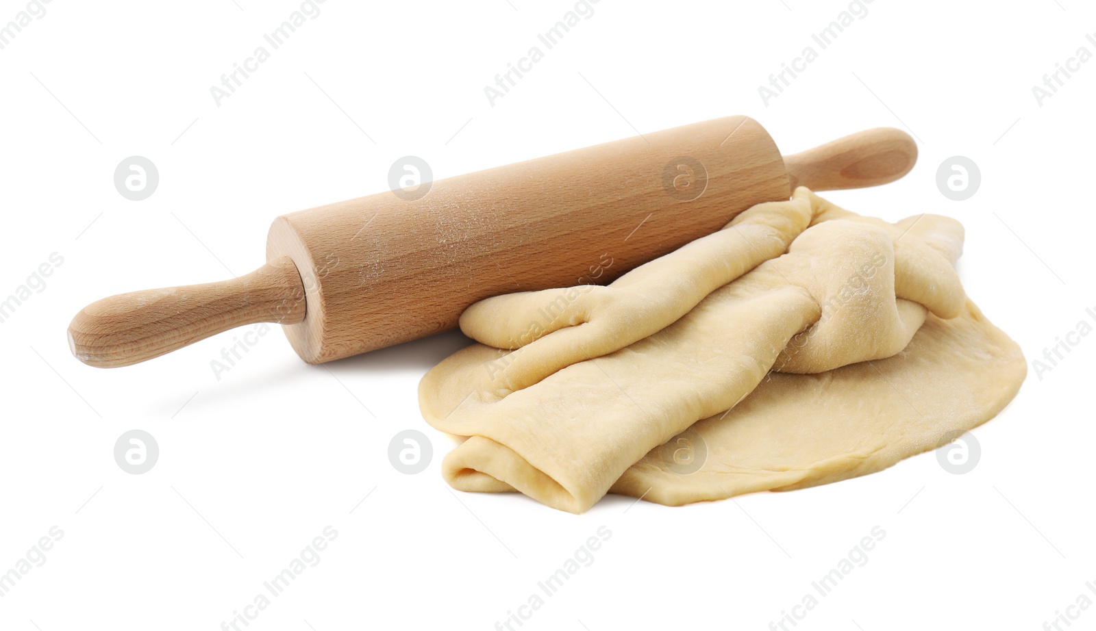 Photo of Raw dough and rolling pin isolated on white