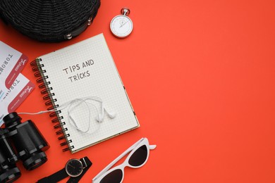 Photo of Flat lay composition with notebook on orange background, space for text. Tips and Tricks
