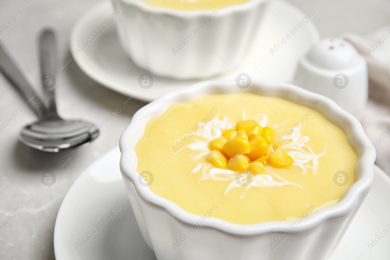 Photo of Delicious corn cream soup in bowl, closeup