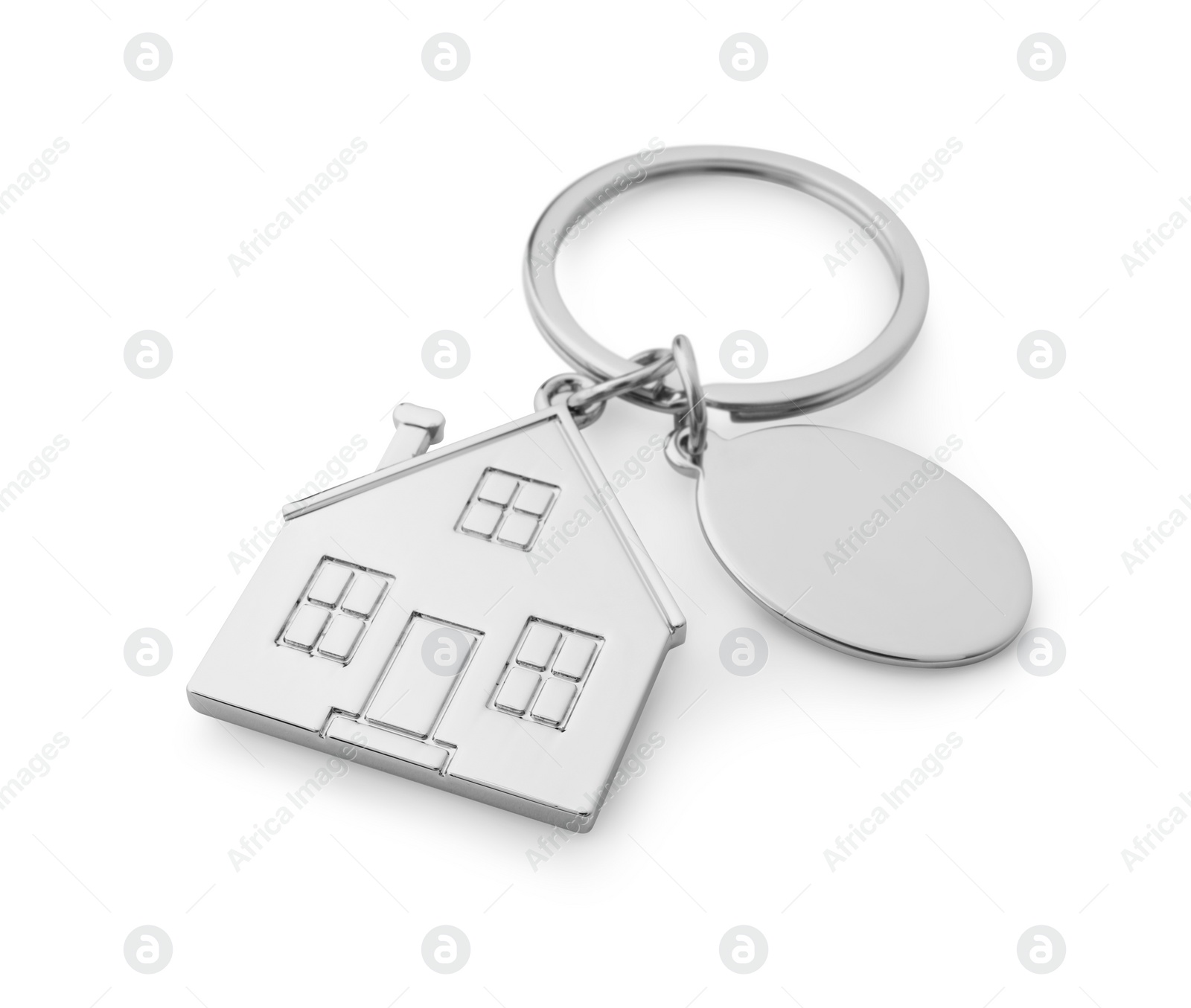 Photo of Metallic keychain in shape of house isolated on white