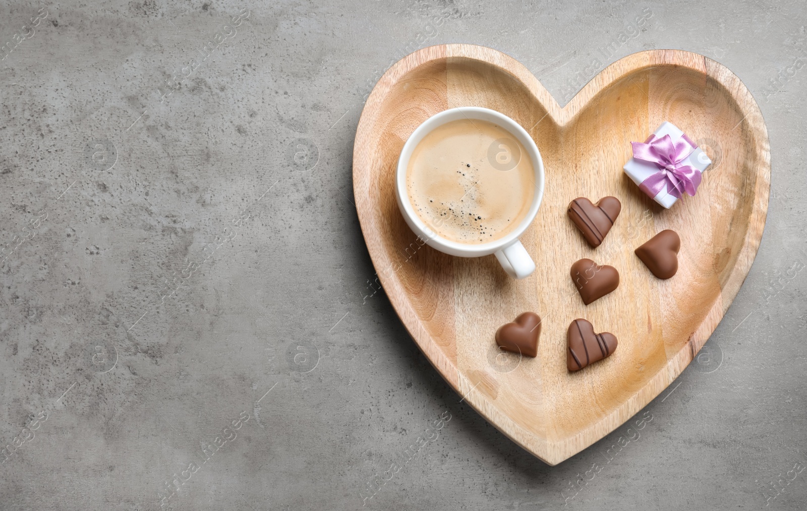 Photo of Romantic breakfast on grey table, top view with space for text. Valentine's day celebration