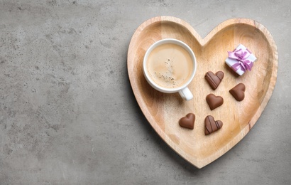 Romantic breakfast on grey table, top view with space for text. Valentine's day celebration