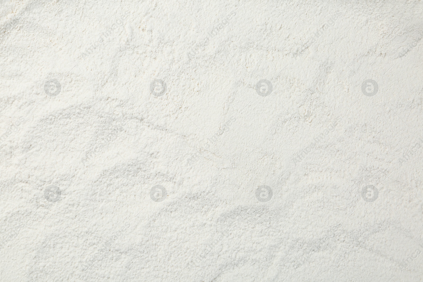 Photo of Pile of organic flour as background, top view