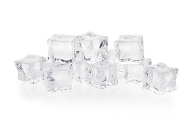 Photo of Many melting crystal clear ice cubes isolated on white